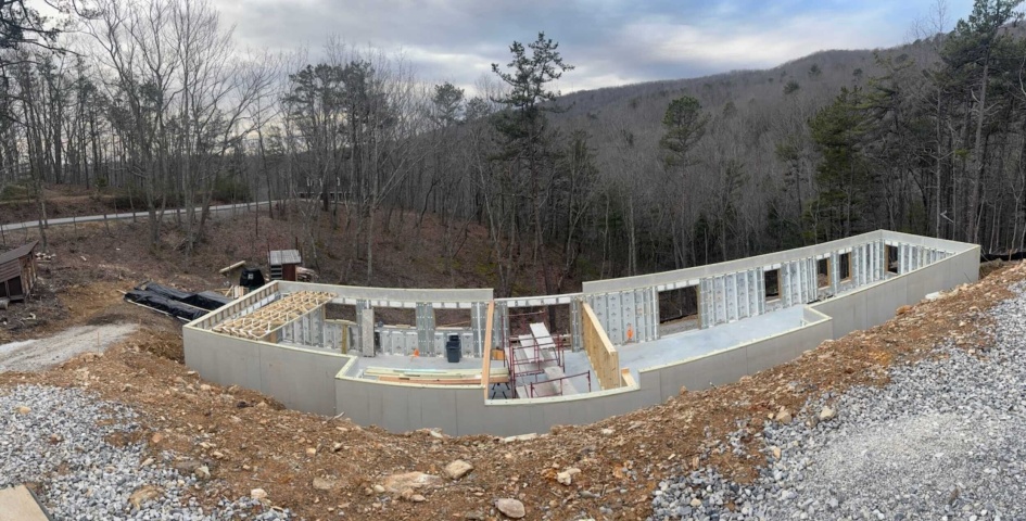 Panelized walls and roof going up on a two story house