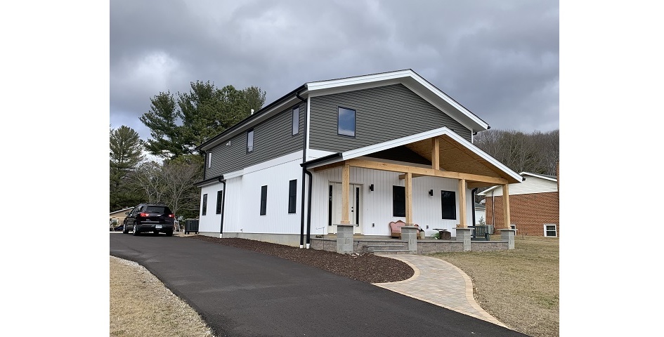 A stone faced home built with panels